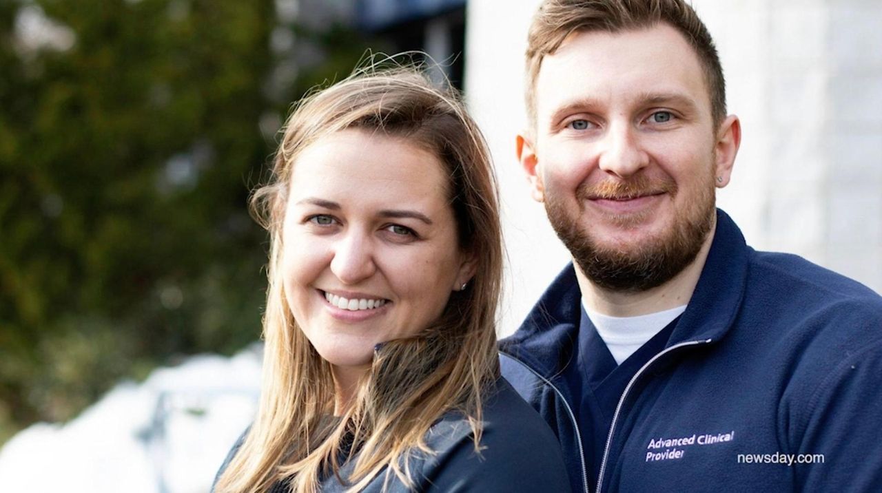 Health care workers and newlyweds Maciej Mazurkiewicz and