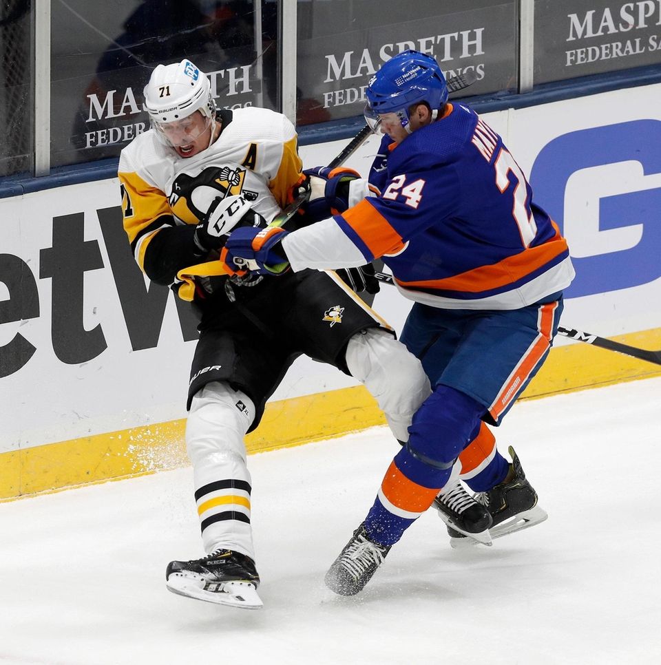 Scott Mayfield of the New York Islanders checks