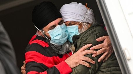 Sukhdev Singh hugs his father Balbir immediately afterwards