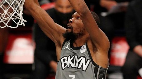 Kevin Durant of the Nets dunks the ball