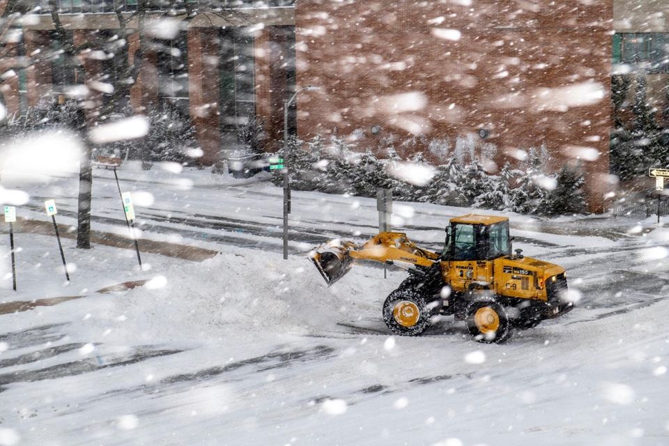 Snow is removed during a major snowstorm in