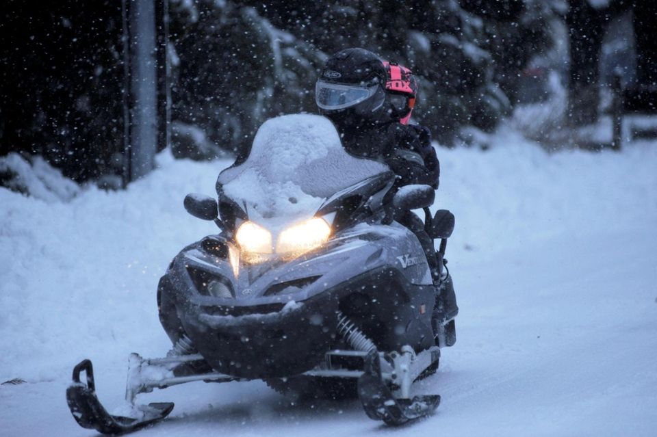 Snowmobiling on Belleview Road in Center Moriches on