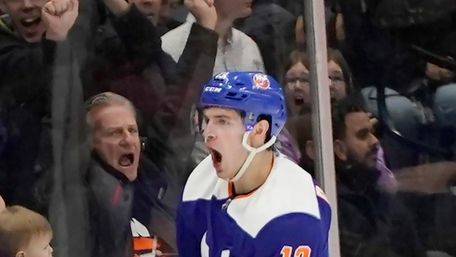 Islanders center Mathew Barzal (13) celebrates a score
