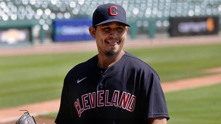 Cleveland starting pitcher Carlos Carrasco walks to the