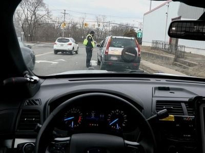 Nassau County police officer Omar Galan giving a