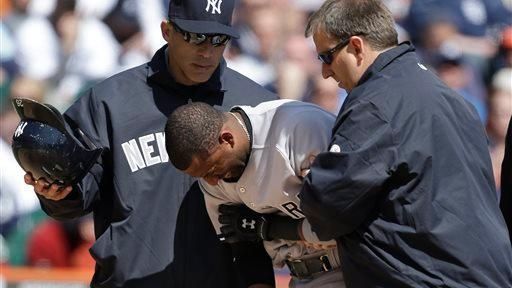 Eduardo Nunez grimaces while helped to the dugout