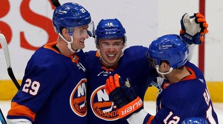 Anthony Beauvillier of the Islanders celebrates his third