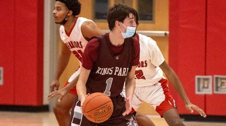 Kings Park's Nick Svolos looks to drive past