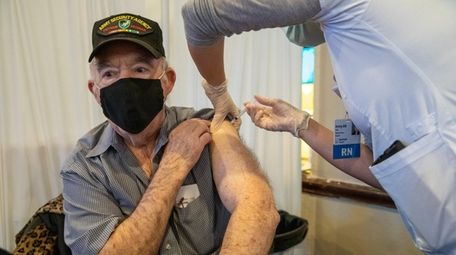Charles Kriss, 82, recieves Pfizer vaccine at pop