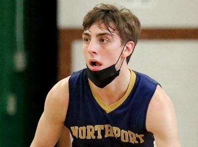 Northport guard Patrick Healy moves the ball into