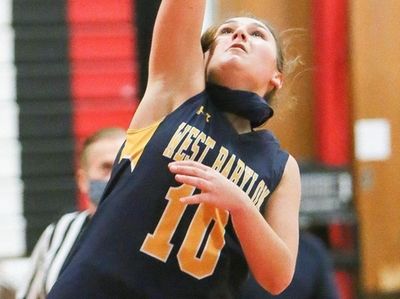 West Babylon's Lacey Downey (10) puts one up