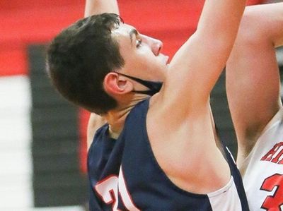 Half Hollow Hills East's Adam Kirschenblatt (30) grabs