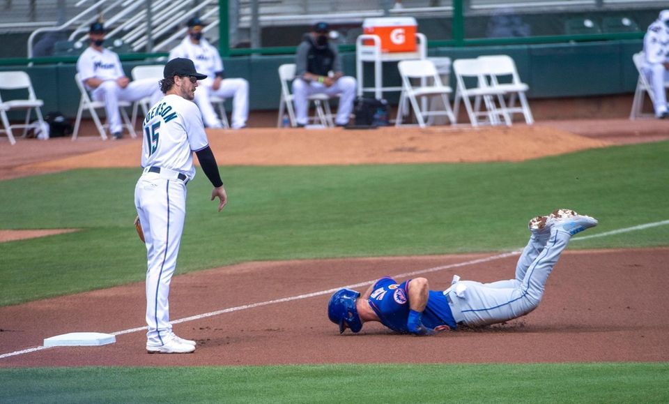 Pete Alonso of the New York Mets slides