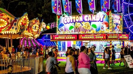 Providing cotton candy, rides, games and entertainment at