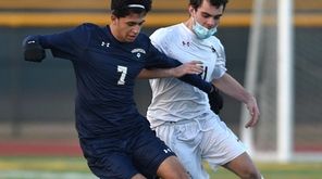 Brandon Rivas #7 of Massapequa, left, gets pressured