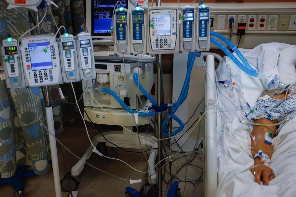 A covid-positive patient, in a medically induced coma,