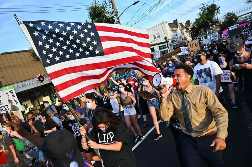 Terrel Tuosto, in tan, leads the march down