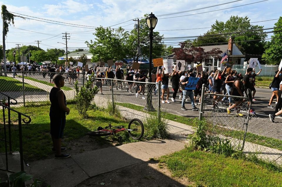 Teziah Clark, 8, of Amityville, watches a crowd