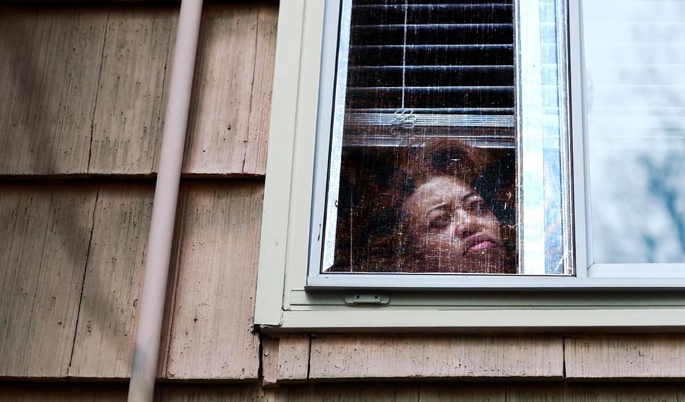 Dr.Michele Reed of Lakeview looks out her bedroom