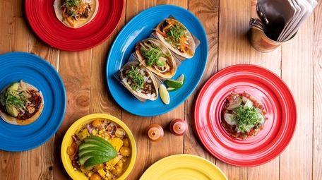 A trio of tacos, Avocado tostada and tomato