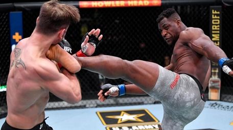 Francis Ngannou kicks Stipe Miocic in their heavyweight