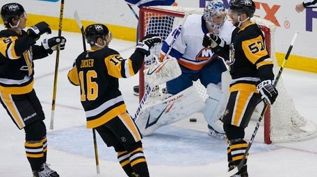 Pittsburgh Penguins' Anthony Angello (57) celebrates with Jason