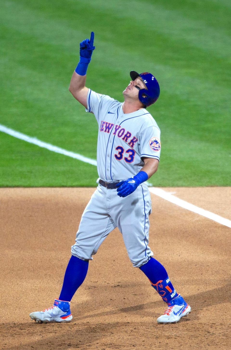 The Mets' James McCann gestures to the sky