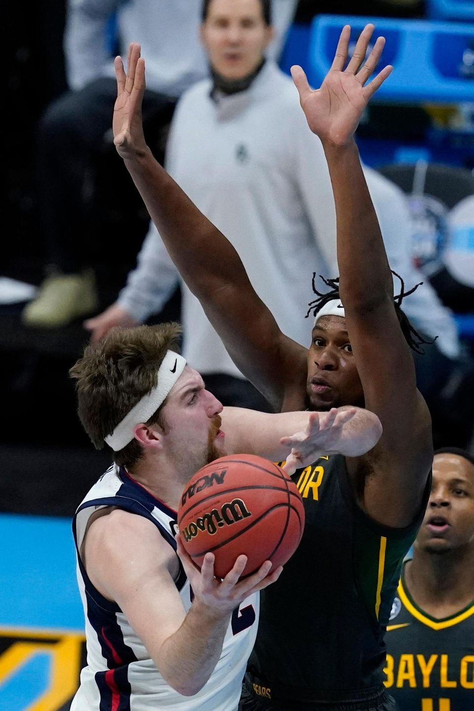 Gonzaga forward Drew Timme, left, shoots over Baylor