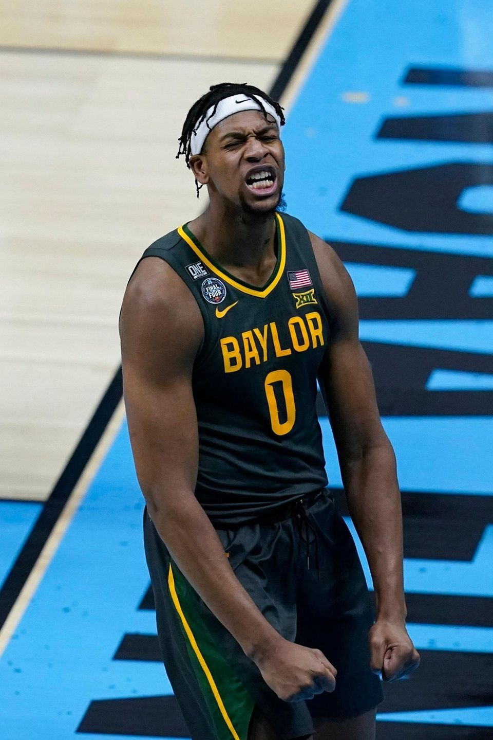 Baylor forward Flo Thamba celebrates after blocking a