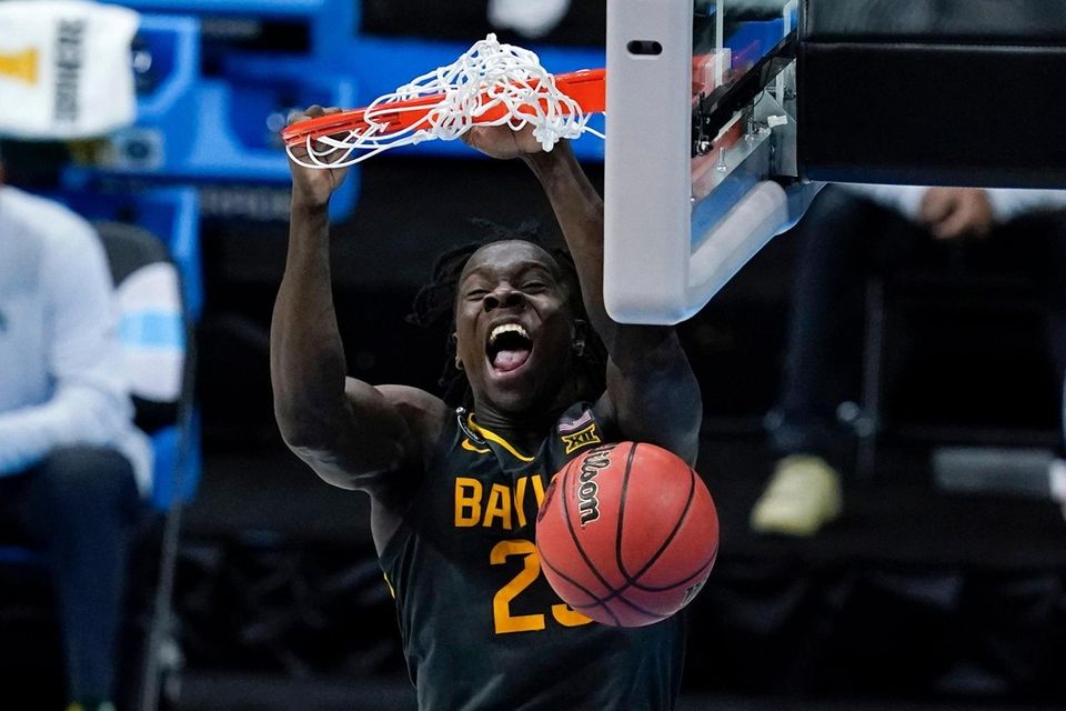 Baylor forward Jonathan Tchamwa Tchatchoua (23) dunks the