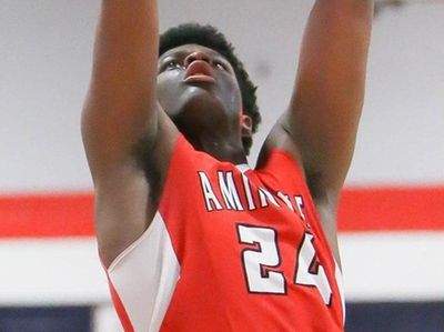 Amityville's Myles Goddard (24) scores in the third
