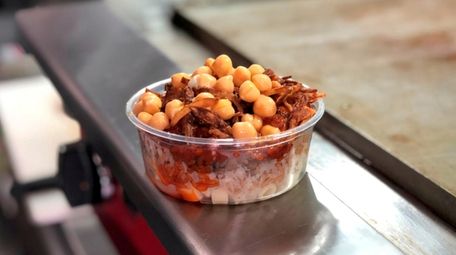 Koshari, an Egyptian specialty featuring rice, pasta, lentils