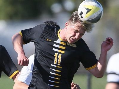 Commack's Tommy Wagner (11) heads the ball in