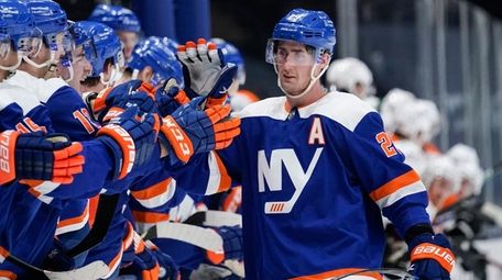Islanders' Brock Nelson (29) celebrates with teammates after