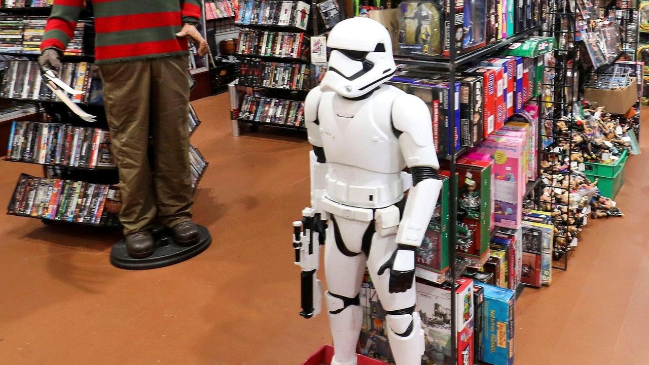 A video showing two women taking a 3-foot-tall stormtrooper that