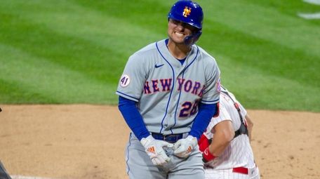 Mets left fielder J.D. Davis (28) reacts after