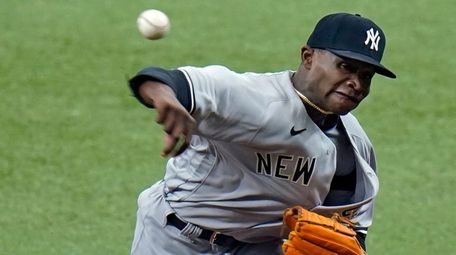 Yankees starting pitcher Domingo German delivers to the