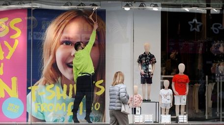 Final touches are made to a window display