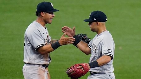 Yankees second baseman Rougned Odor, right, celebrates with