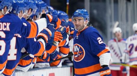 The Islanders' Kyle Palmieri (21) celebrates with teammates