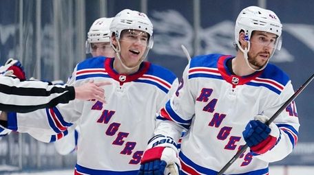 The Rangers' Brendan Smith, right, and Libor Hajek,