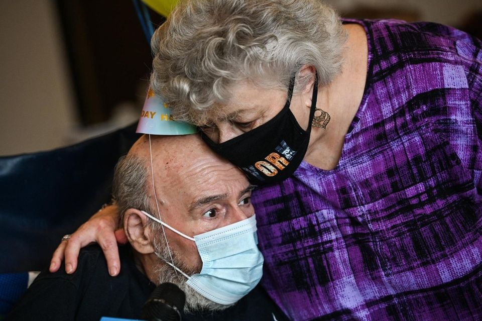 Rene Mennes, of Brookhaven, receives a hug on