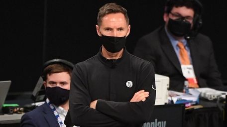 Nets head coach Steve Nash looks on during