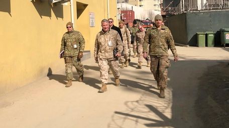 Marine Gen. Kenneth "Frank" McKenzie, center, commander of