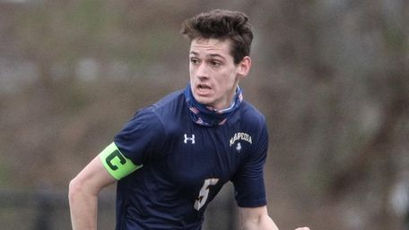 Thomas O'Neill of Massapequa looks to pass during