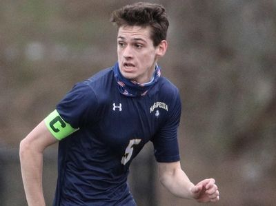 Thomas O'Neill of Massapequa looks to pass during