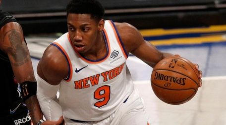 RJ Barrett #9 of the Knicks controls the