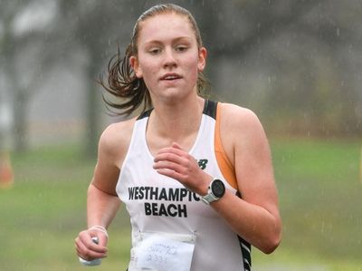 First place winner, Jackie Amato of Westhampton, crosses