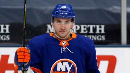 Michael Dal Colle #28 of the Islanders warms