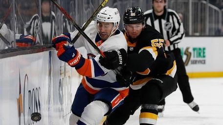 Islanders' Jordan Eberle tries to get past Boston